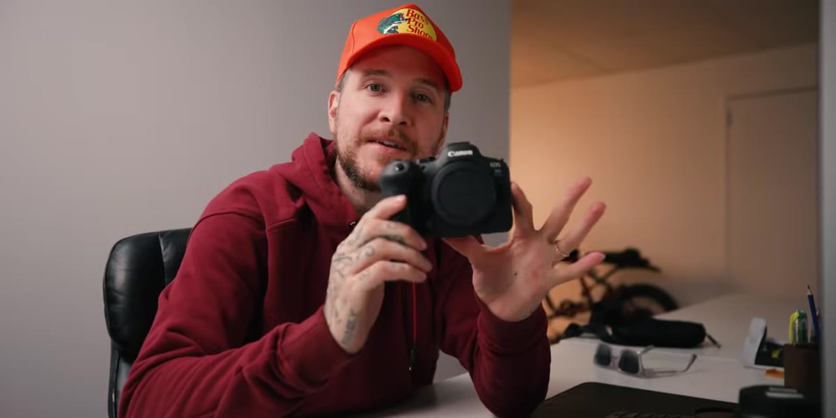 Peter pointing to the new toggle switch on top left of camera