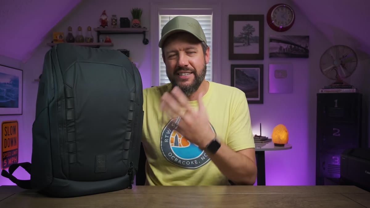 Denney showing the bag&rsquo;s minimal, all-black exterior design