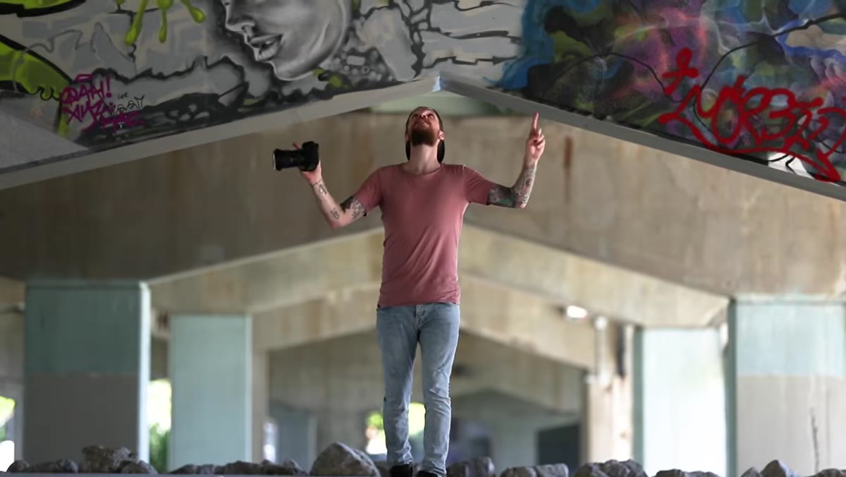 Subject placed centrally between converging pillars in skate park