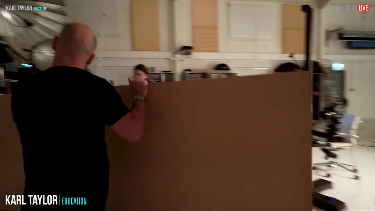 Painted hardboard background placed behind the bottle