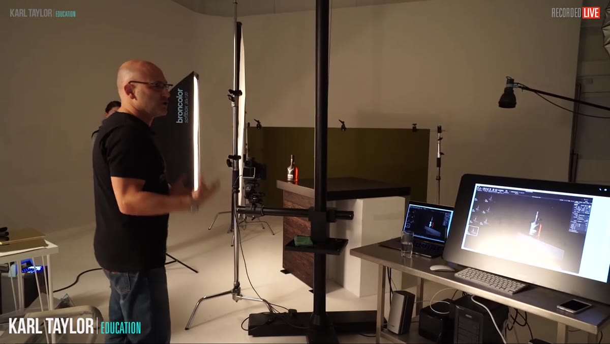 Carl assessing the full setup, background and product both visible