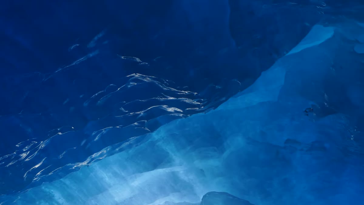 Close-up of ice surface texture showing contours and translucency