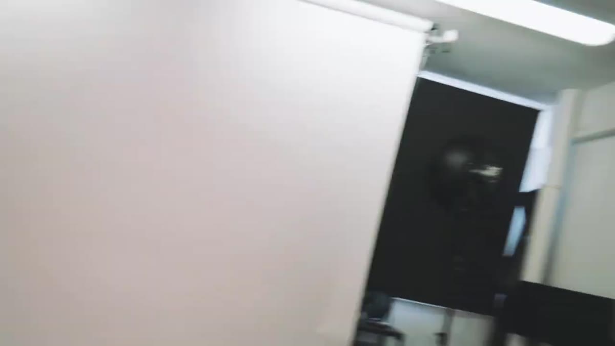 Background strobe aimed upward onto white paper roll