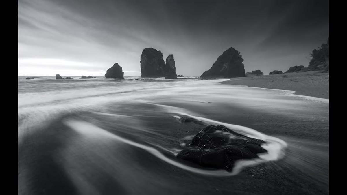 Camera settings with slow shutter capturing water motion over rocks