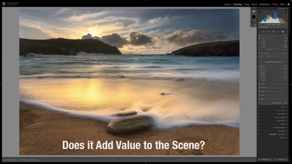 Photographer examining different regions of a landscape photo