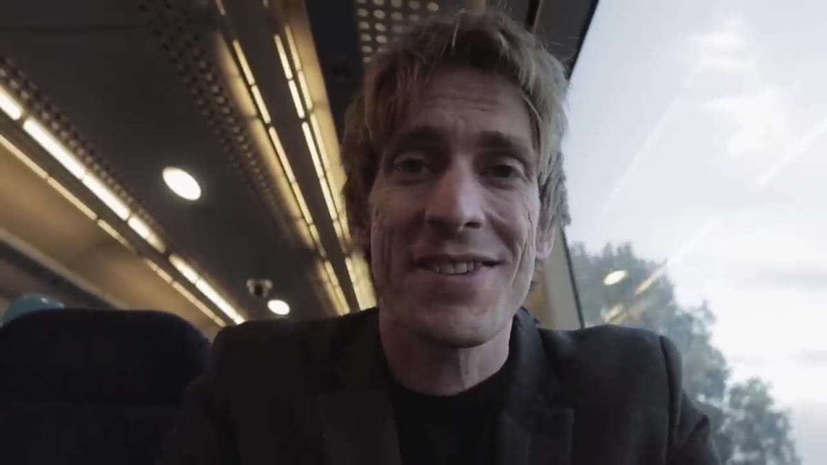 Tucker on train, speaking candidly about feeling nervous