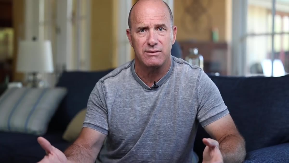 Joel Grimes speaking directly to camera about photography education
