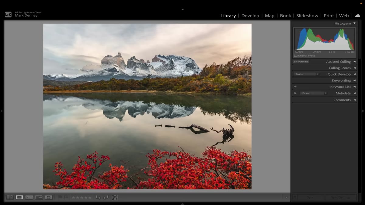 Mark sitting down to edit Patagonia images in post-processing software