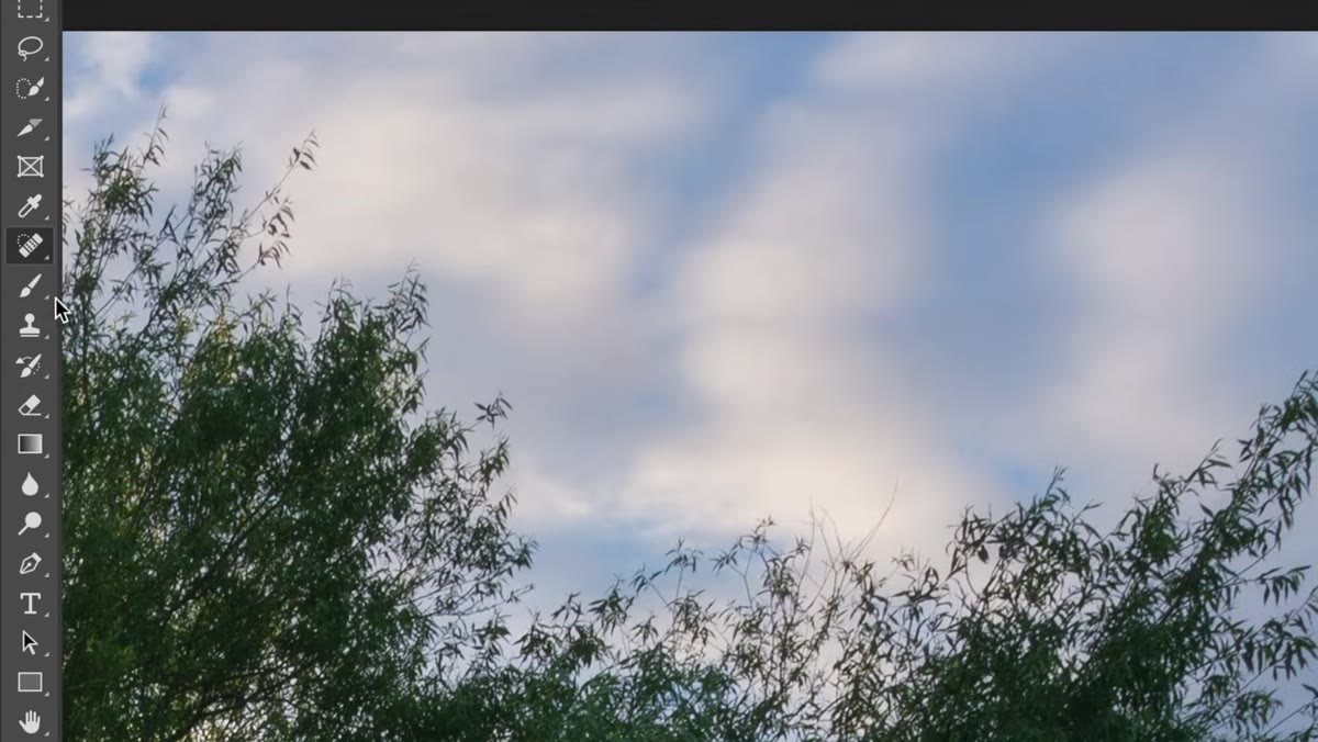 Clone stamp tool selected with opacity and hardness settings visible