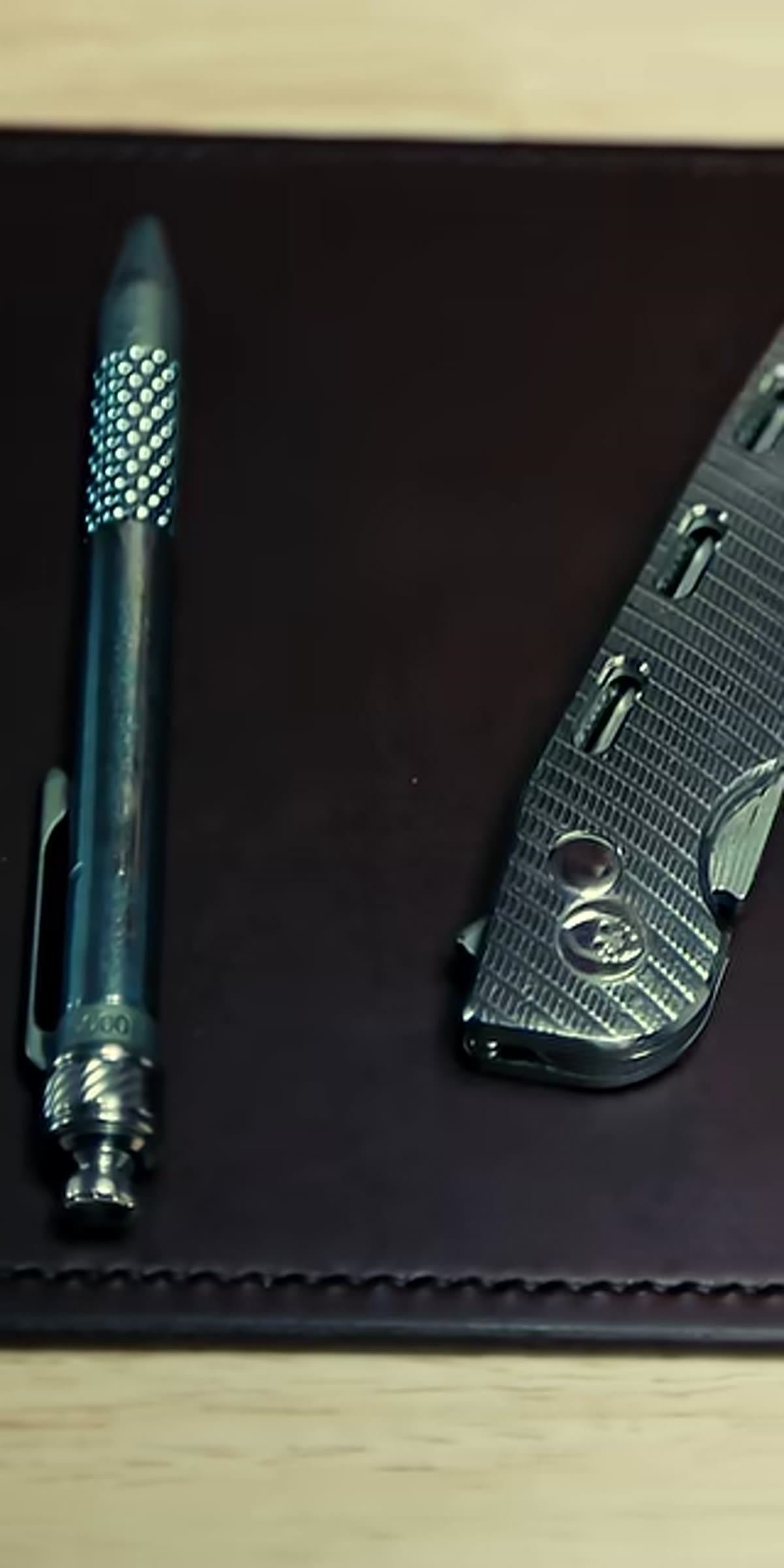 Three pens lined up, black, blue, and red