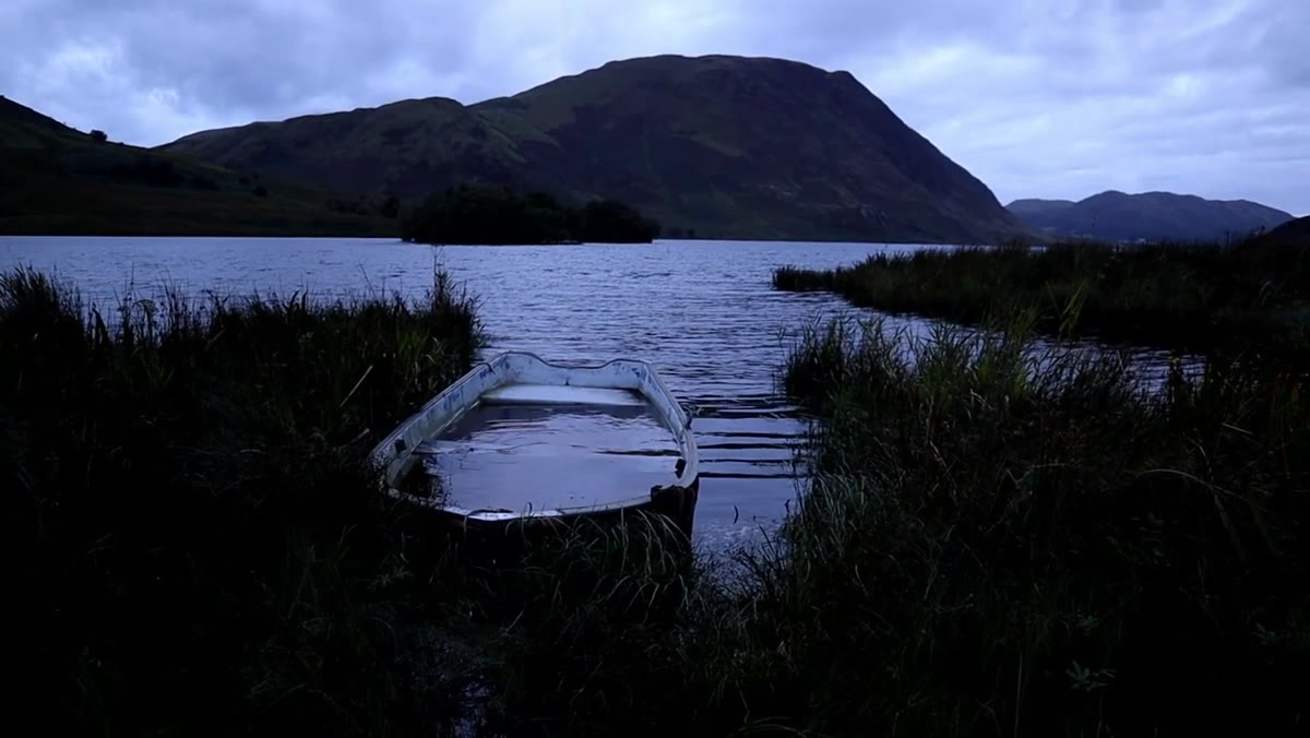 Wide view of the submerged boat in flat morning light
