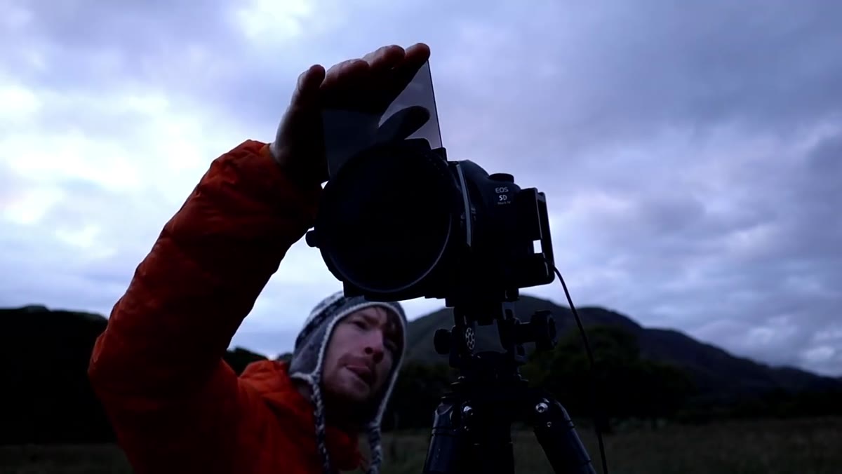 Close-up of 6-stop ND filter being attached to lens